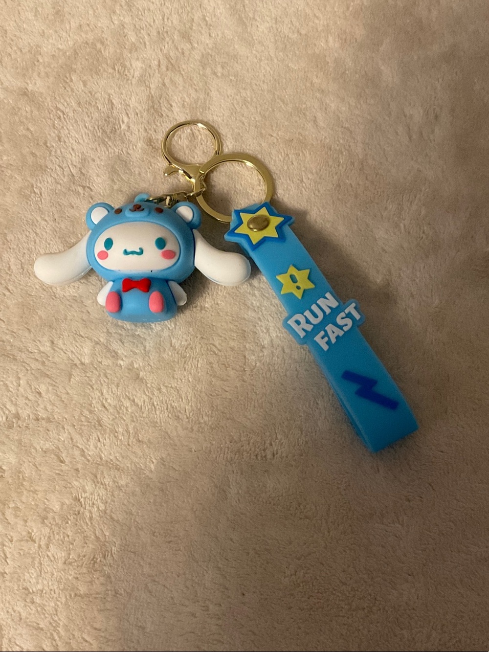 Cute Blue Cartoon Character Keychain with 'Run Fast' Strap